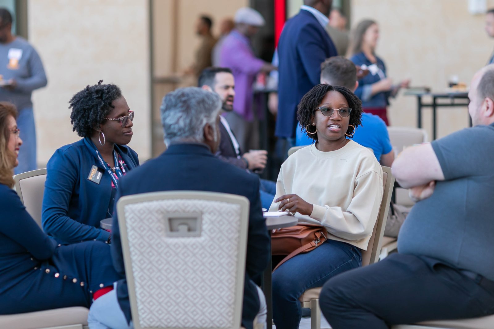 Creators networking outdoors between sessions
